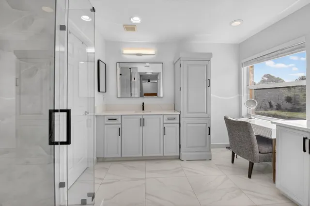 a bathroom with a sink and a mirror