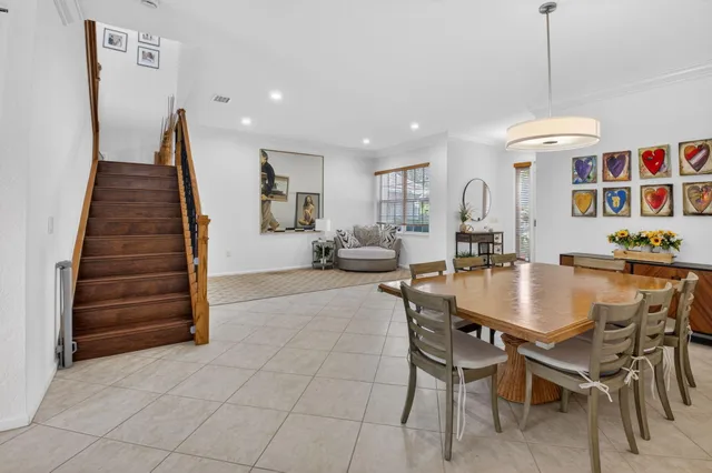 a dining room with furniture and entryway