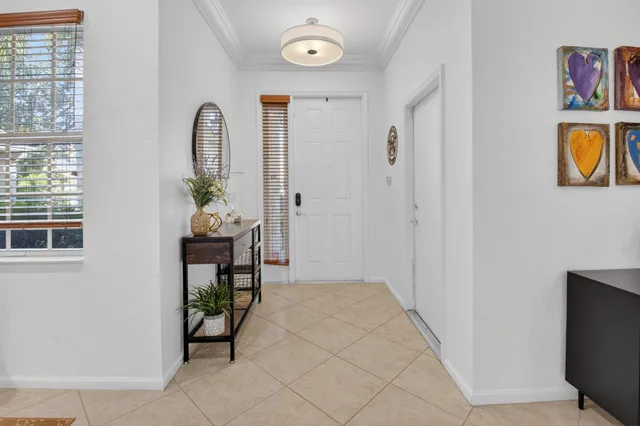 a view of an entryway with wooden floor
