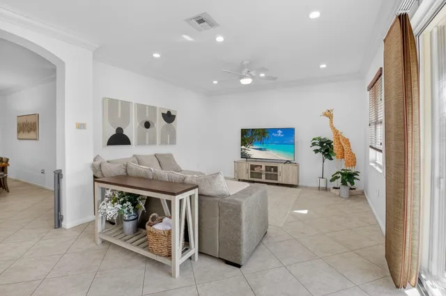 a living room with furniture and a gym