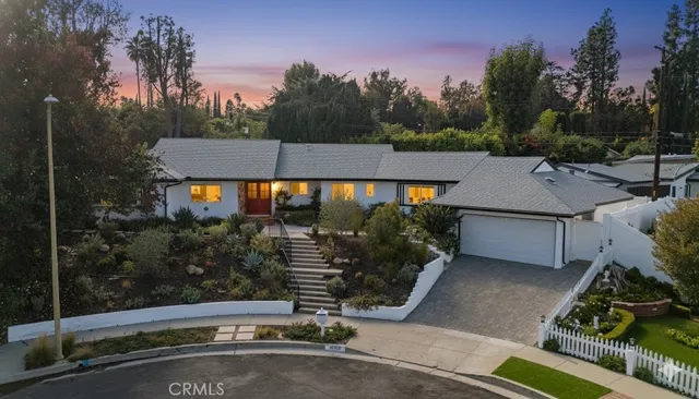 a house view with a garden space