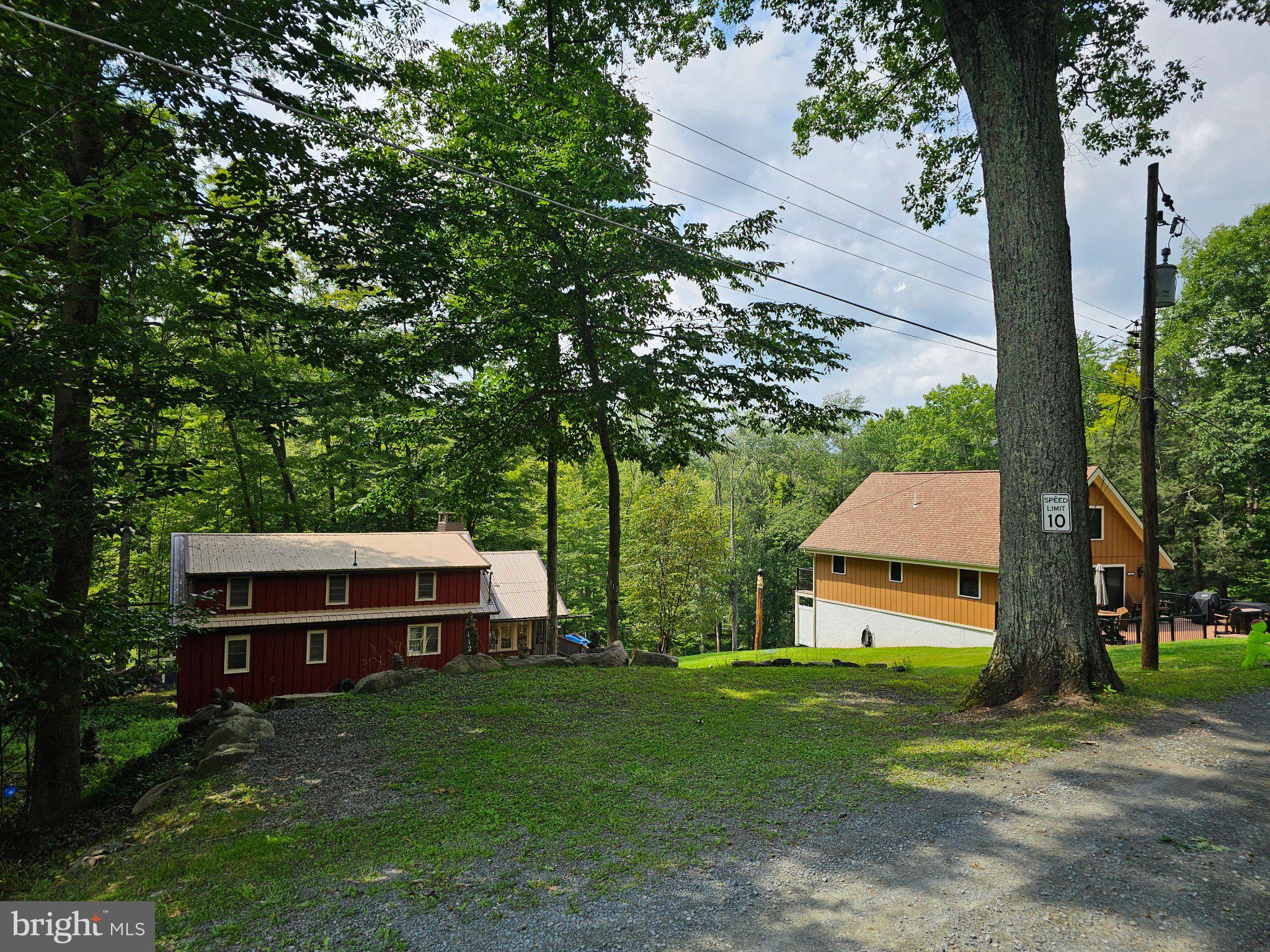 112 Beechwood Cove Road Greentown, PA 18426 - Photo 52 of 59 a front view of a house with garden