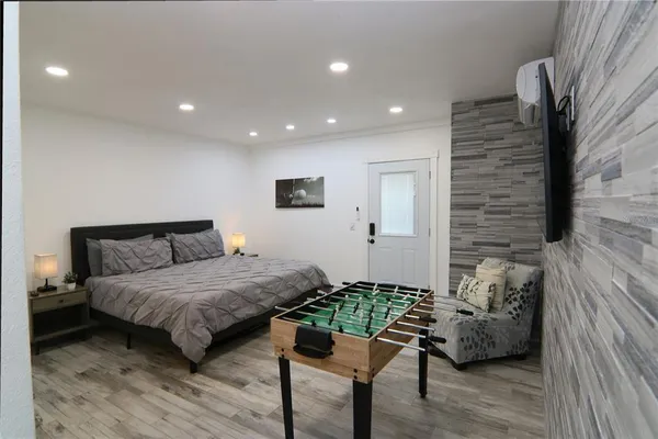 a room with pool table and a flat screen tv