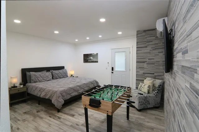a room with pool table and a flat screen tv