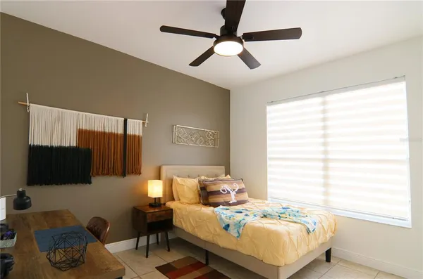 a bedroom with bed and a window