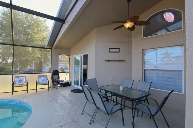 a living room filled with furniture and a large window
