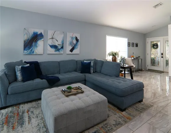 a living room with furniture and a couch