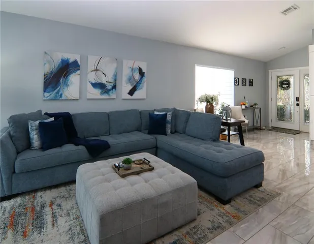 a living room with furniture and a couch