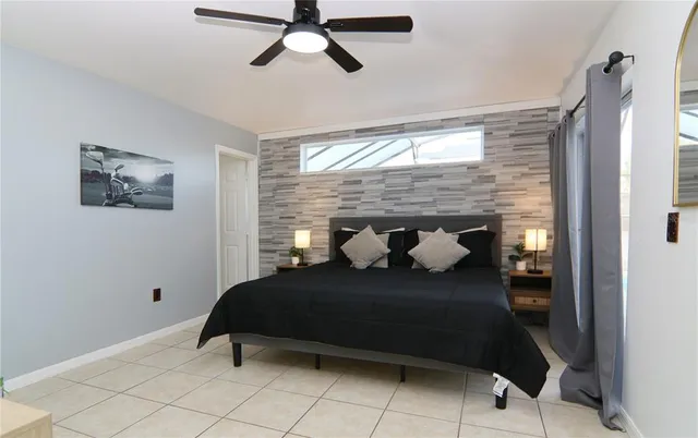 a bed room with a bed and a window