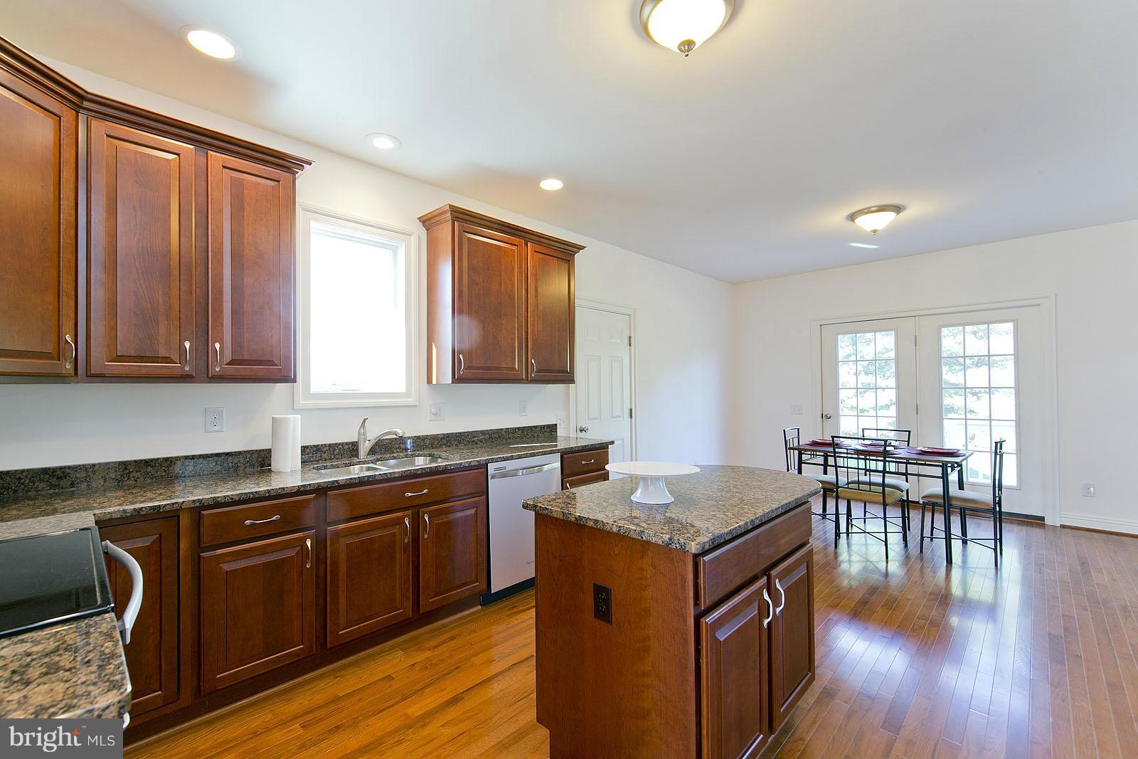 481 Bowling View Road Front Royal, VA 22630 - Photo 11 of 30 a kitchen with granite countertop sink stove and dining table