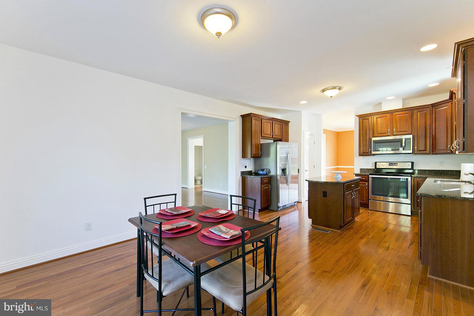481 Bowling View Road Front Royal, VA 22630 - Photo 12 of 30 a view of a dining room with furniture and wooden floor