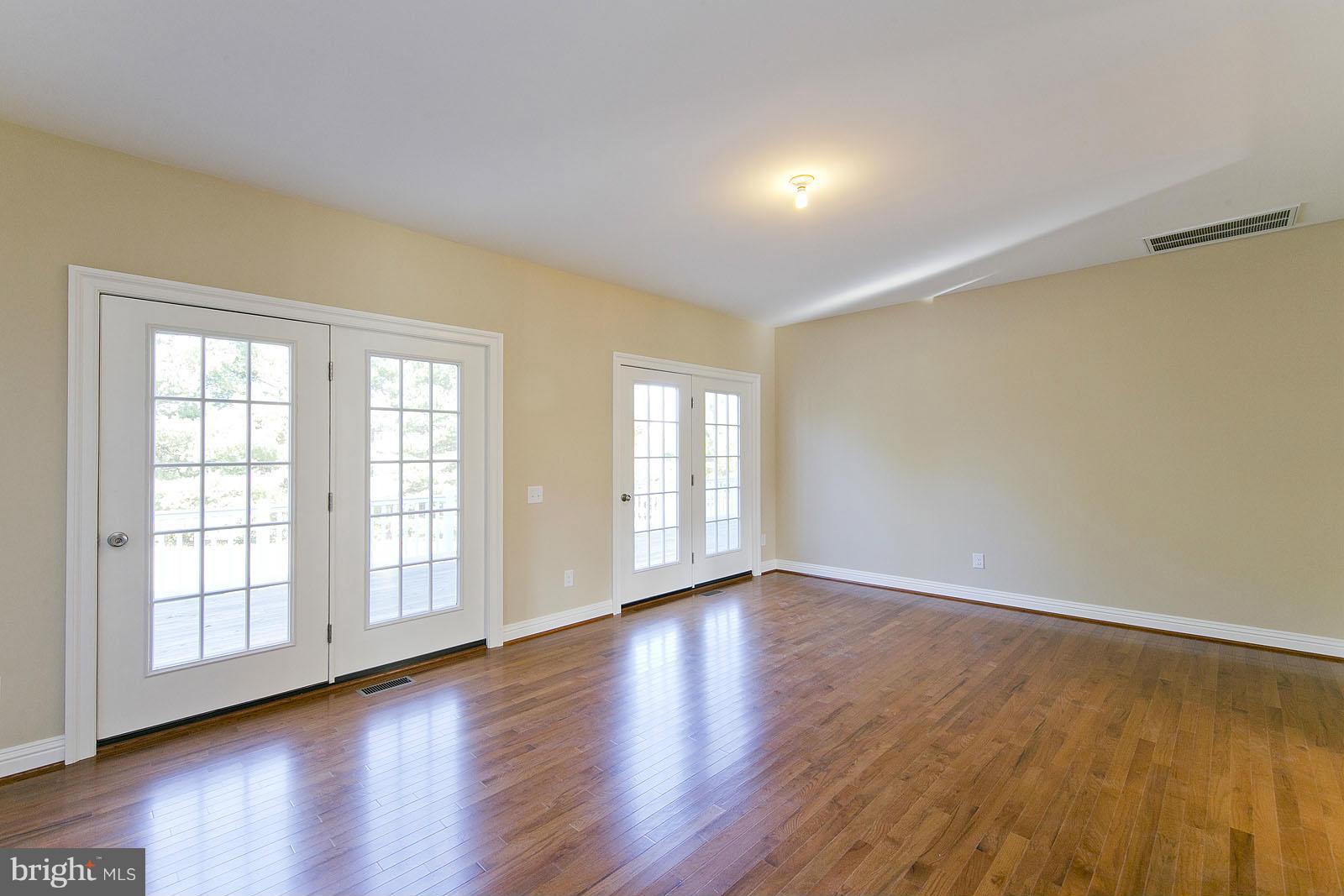 481 Bowling View Road Front Royal, VA 22630 - Photo 5 of 30 a view of an empty room with wooden floor and a window