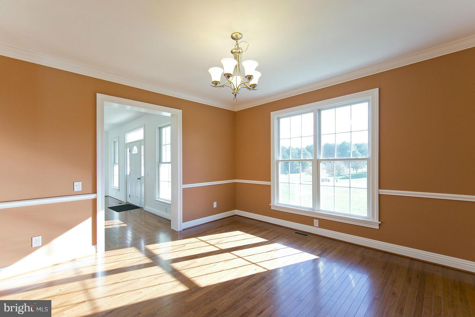 481 Bowling View Road Front Royal, VA 22630 - Photo 6 of 30 a view of an empty room with glass door and windows