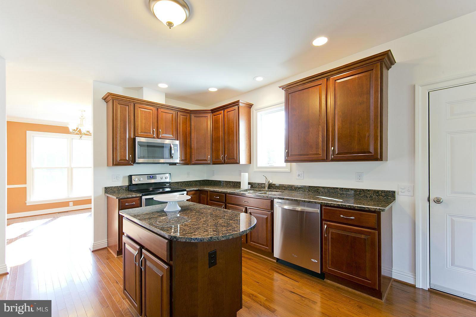 481 Bowling View Road Front Royal, VA 22630 - Photo 8 of 30 a kitchen with stainless steel appliances granite countertop a stove sink and cabinets