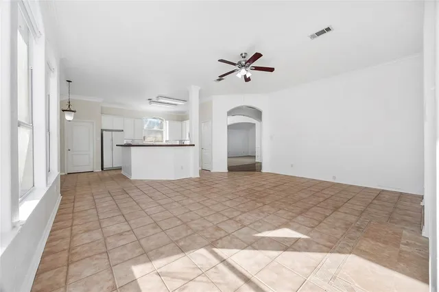 a view of empty room with a fireplace