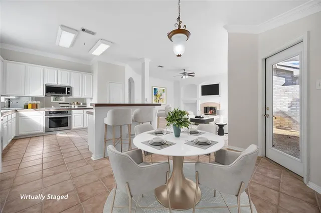 a view of kitchen with sink and breakfast area
