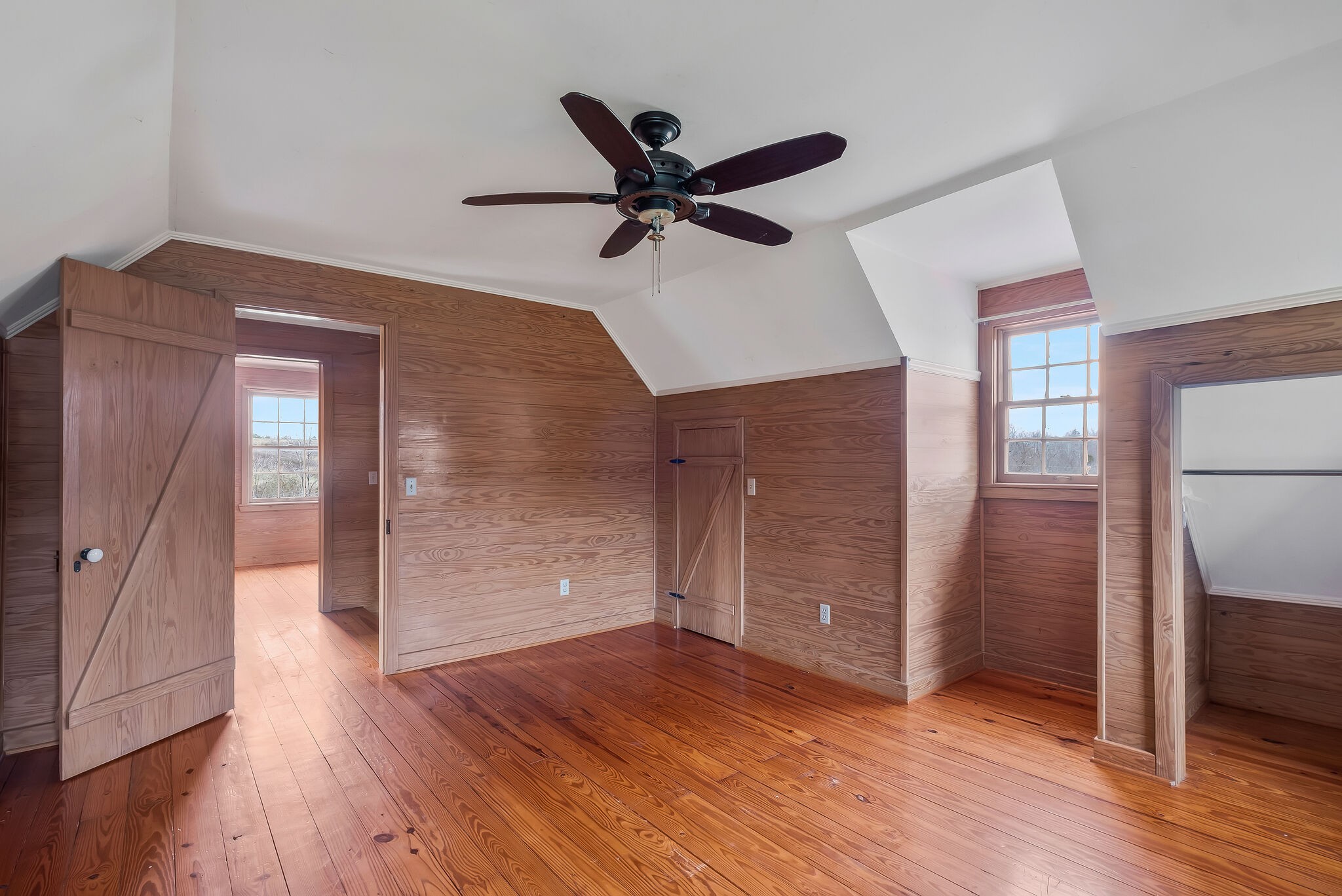198 Treece Lane Waynesboro, TN 38485 - Photo 25 of 69 a view of a livingroom with wooden floor and a ceiling fan