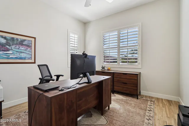a bathroom with a sink a mirror a toilet and a mirror