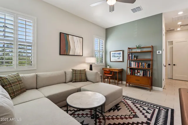 a living room with furniture and a window