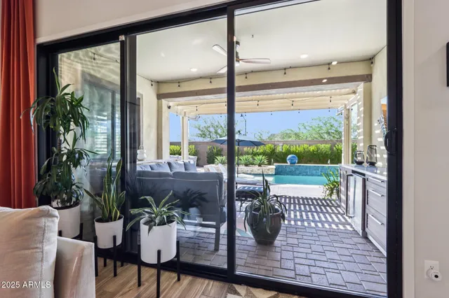 a view of a living room with furniture and a potted plant