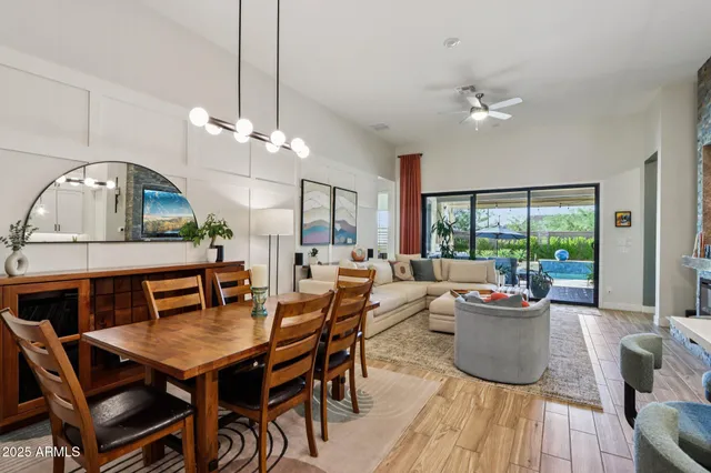 a living room with furniture a chandelier and a couch