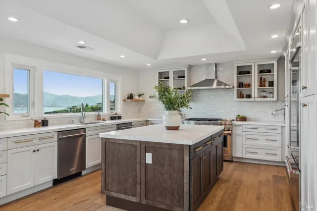 a kitchen with a stove a sink and a refrigerator