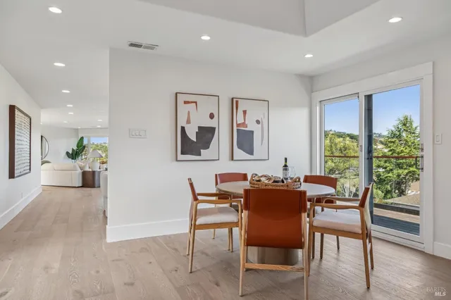 a view of a dining room with furniture window and outside view