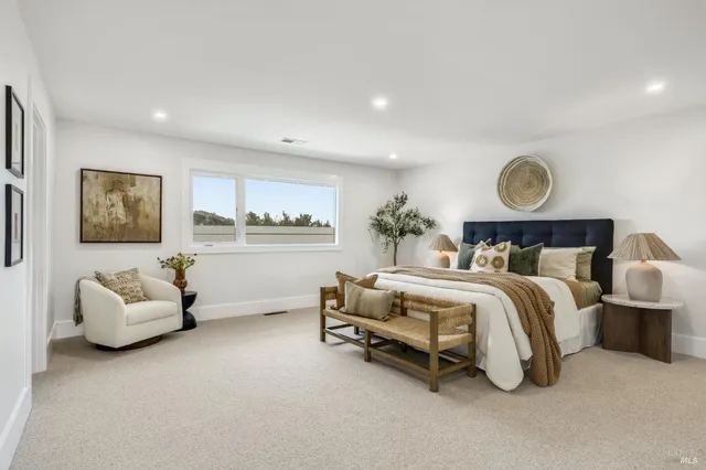 a bedroom with bed and a lamp