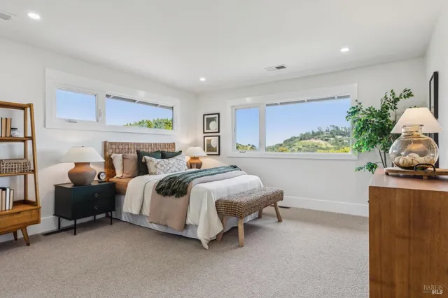 a bedroom with a bed and a couch