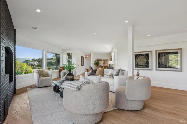 a living room with fireplace furniture and a flat screen tv