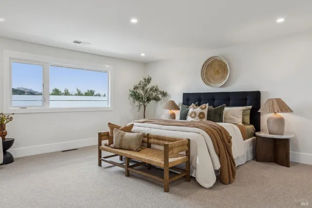 a bedroom with bed and window