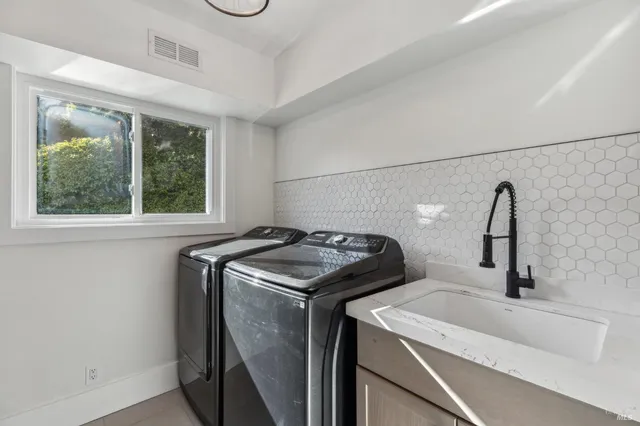 a utility room with dryer and washer