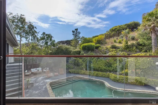 a view of a balcony with an outdoor space