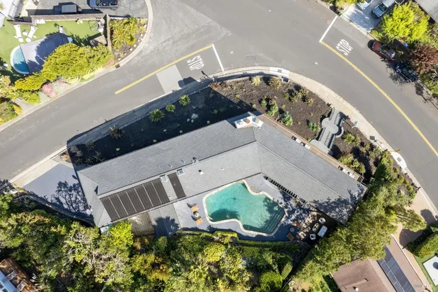 an aerial view of a house a yard and garden