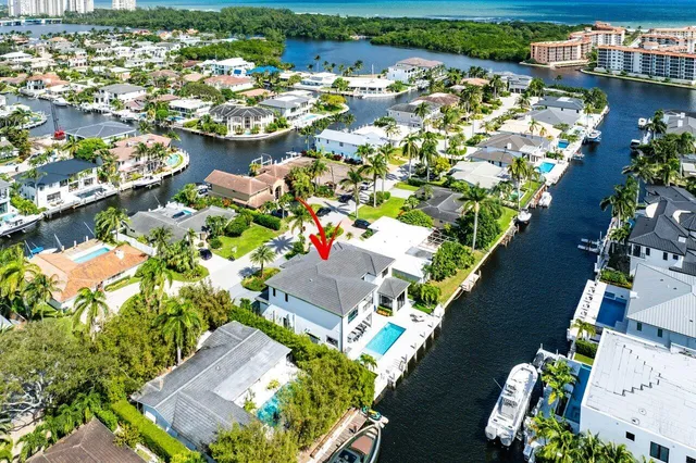 an aerial view of a house with a lake view