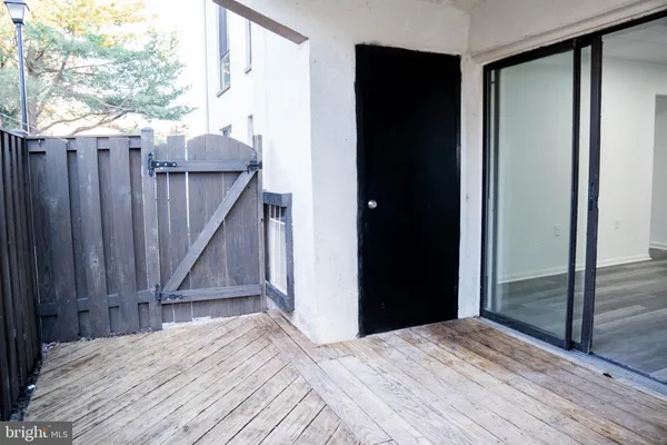a view of a deck with wooden floor and stairs