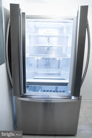 a view of a refrigerator in kitchen