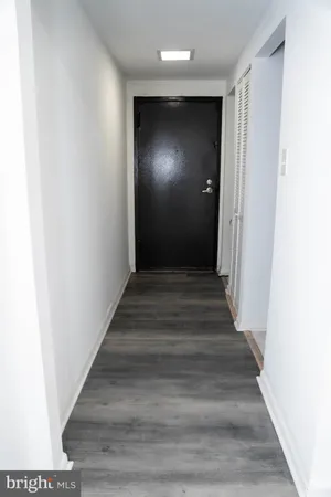 an empty room with wooden floor