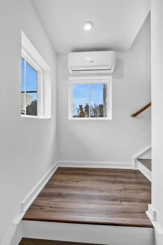 a room with a bed and a window