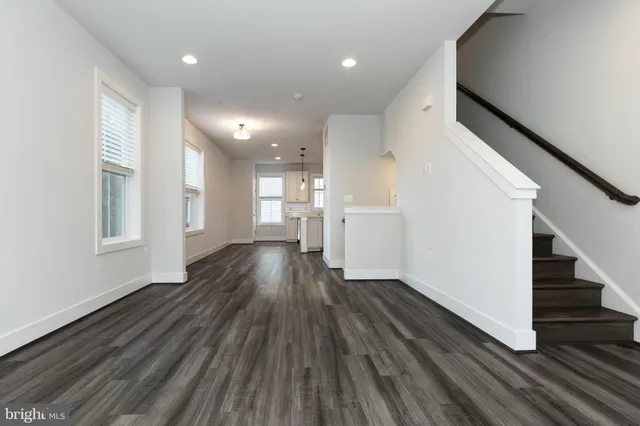 a view of entryway with wooden floor