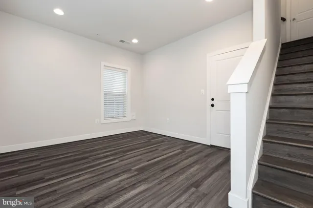 a view of an entryway with wooden floor