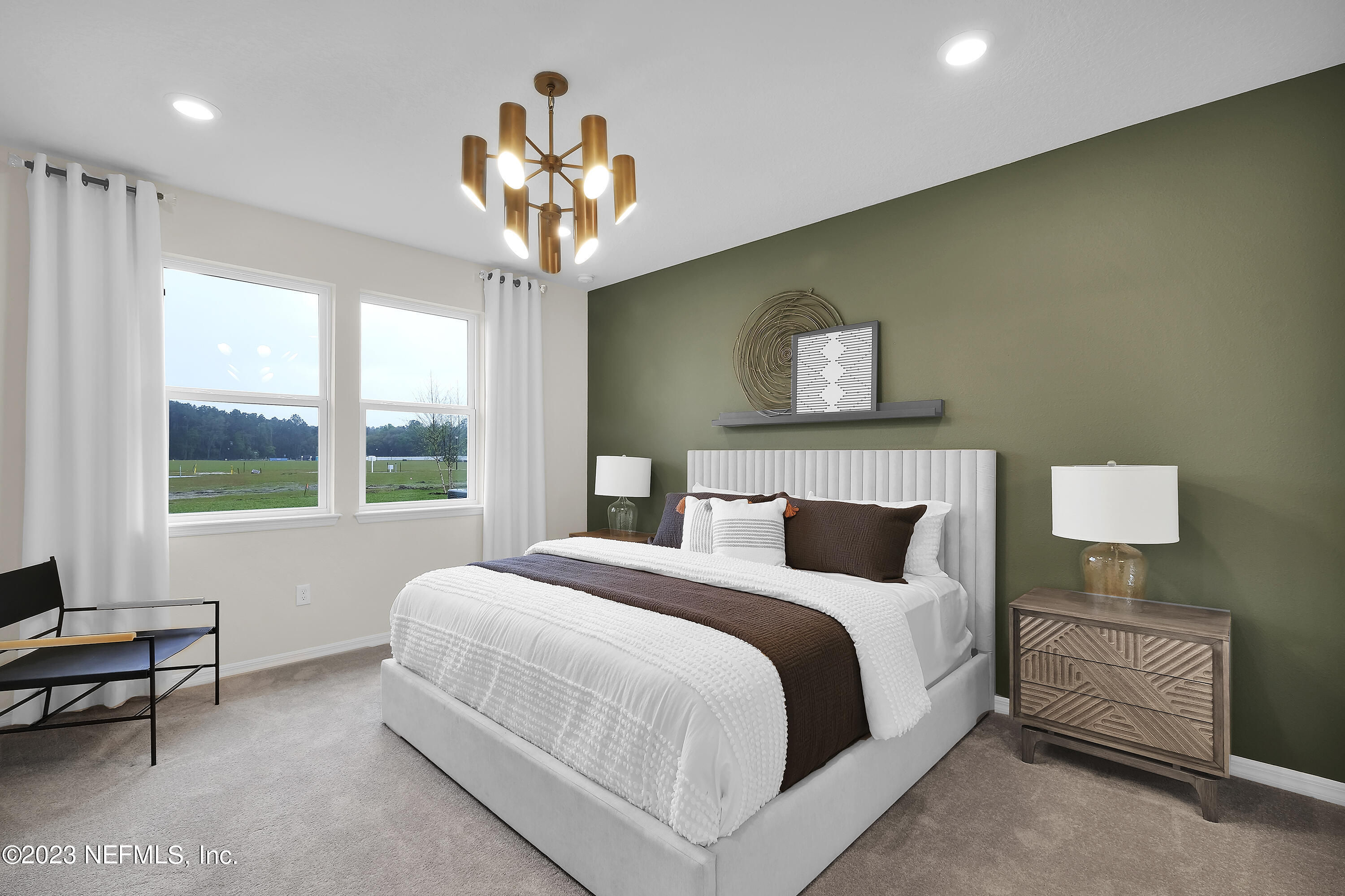 127 Shell Crk Court St. Augustine, FL 32086 - Photo 15 of 21 a bedroom with a bed and a chandelier
