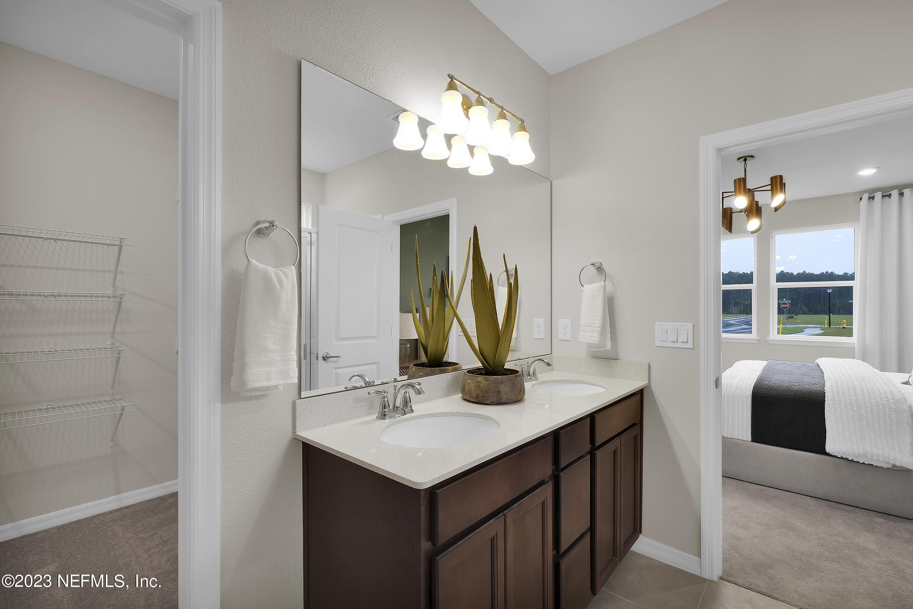 127 Shell Crk Court St. Augustine, FL 32086 - Photo 16 of 21 a bathroom with a sink a vanity and a mirror