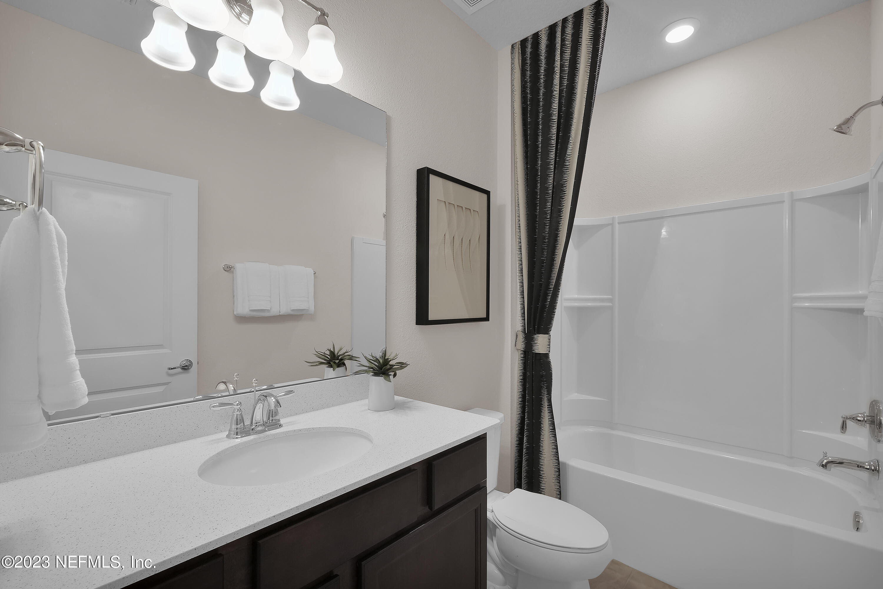 127 Shell Crk Court St. Augustine, FL 32086 - Photo 3 of 21 a bathroom with a sink a toilet a mirror and shower