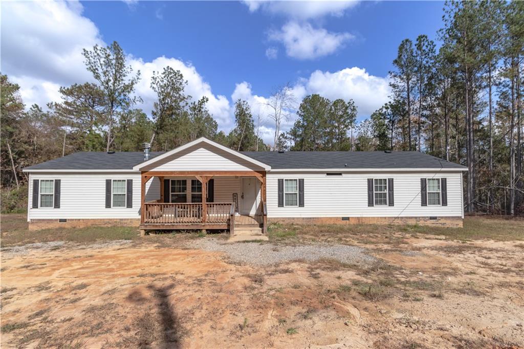 2460 Black Shoals Road Northeast Conyers, GA 30012 - Photo 1 of 1 a front view of a house with a yard