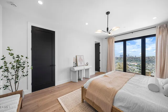 a living room with furniture and a mirror