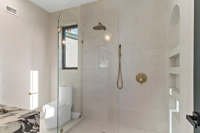 a room with lots of furniture and view of living room