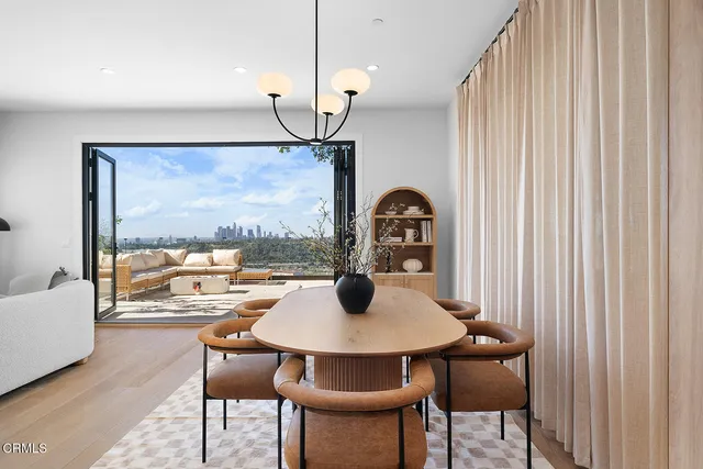 a view of a dining room with furniture window and outside view