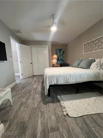 a bedroom with a bed and a chair