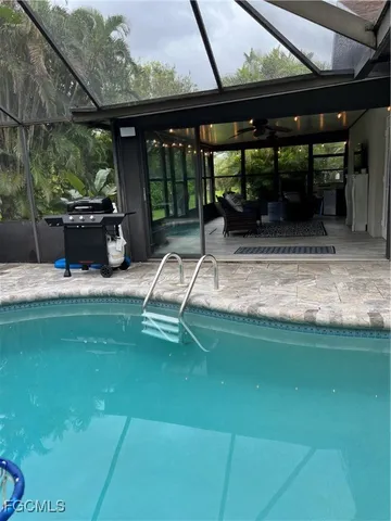 a view of a swimming pool with a patio